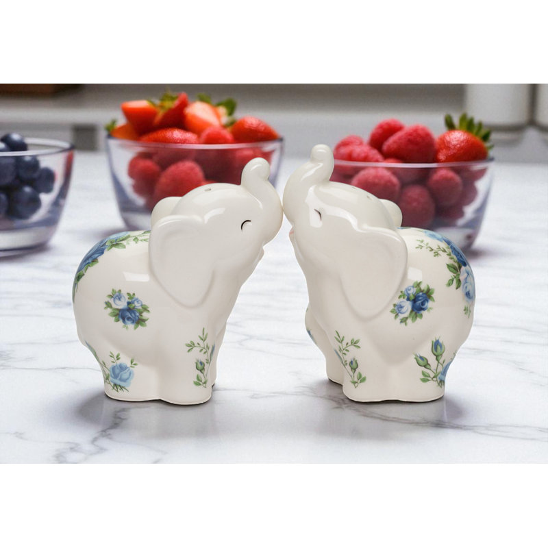 Éléphants avec des roses bleues sel et poivre