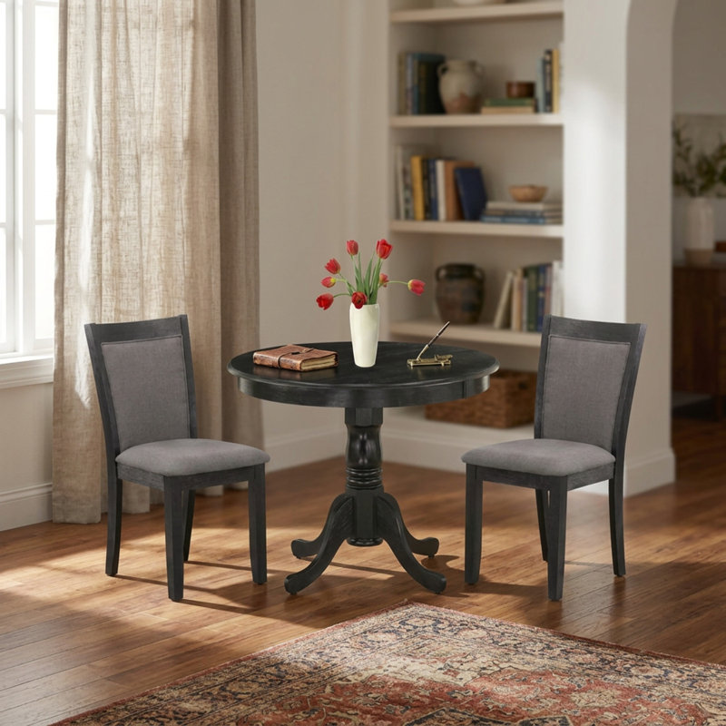 Ensemble de salle à manger 3 pièces avec table ronde sur pied central, chaises rembourrées et revêtement en lin et bois d'hévéa gris foncé Gotham, finition brossée noire.