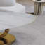 Table basse en marbre avec base sculpturale en acier inoxydable-691929687