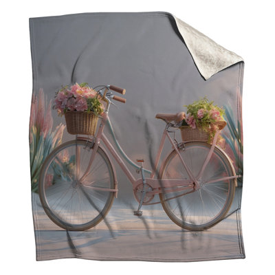 Vélo rose avec couvertures fleurs