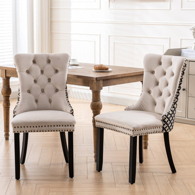 Beige Velvet Dining Chairs  2  . High Solid Wood Furniture. Style With High . Decorative Rivets For Luxury. Comfortable Foam Cushion. Strong Construction, Up To 280 Pounds. Adjustable Leg Pegs