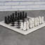 Jeu d'échecs fait à la main en marbre blanc et noir-87347234
