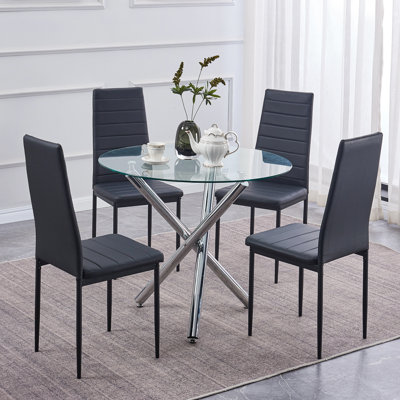 Ensemble de salle à manger pour 4, 5 pièces Table de salle à manger ronde en verre Ebern Designs avec 3 pieds chromés et 4 chaises en métal noir pour la salle à manger