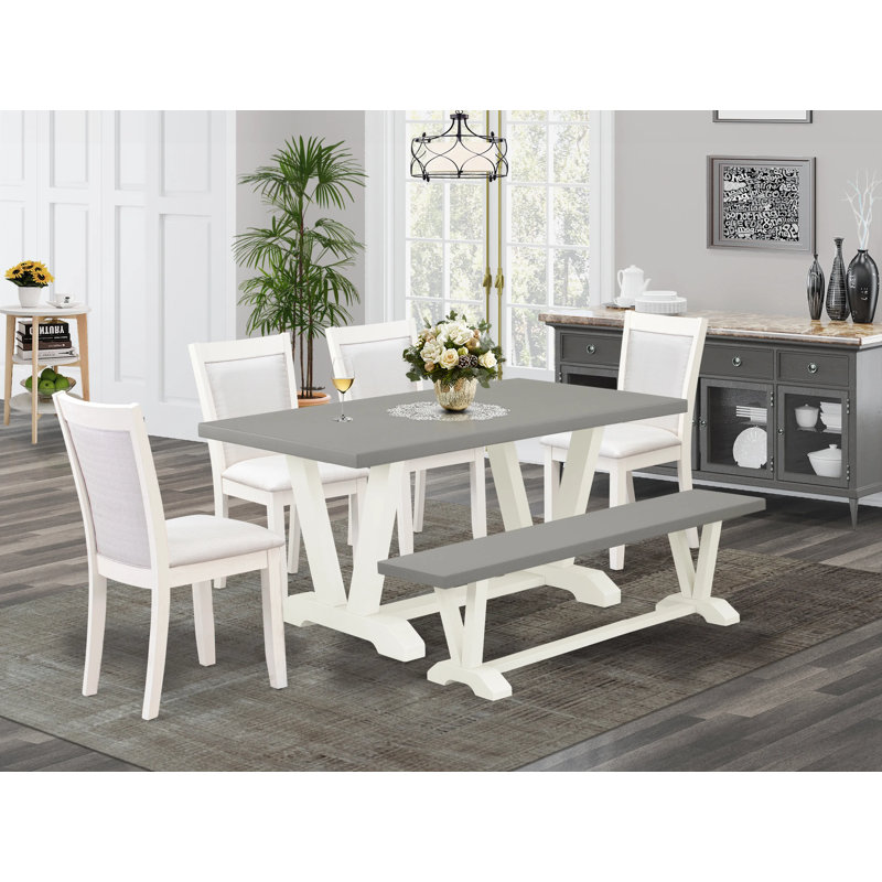 The 6-piece dining table set contains a cement rectangular table a wooden bench and 4 cream linen fabric upholstered chairs with high back-wire brushed linen white.