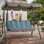 Balancelle de patio à 3 places Kozyard Alicia, balançoire à baldaquin d'extérieur avec structure en acier, baldaquin réglable et coussins amovibles pour terrasse de jardin, rayure bleue