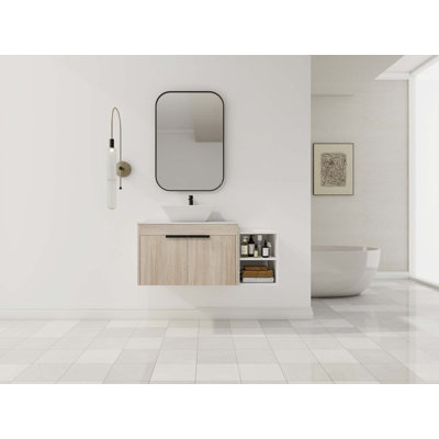 Meuble-lavabo flottant avec lavabo d'art en céramique, dalle de pierre plate blanche et petites tablettes de rangement