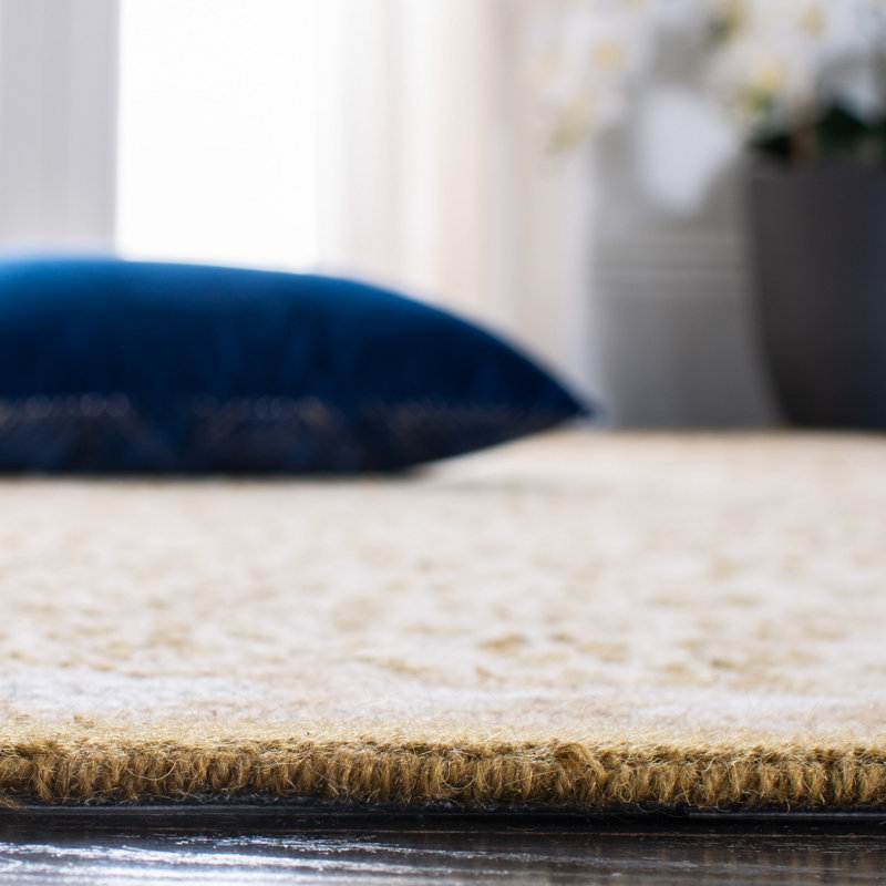 Handmade Oval Ivory Wool Animal Print Area Rug