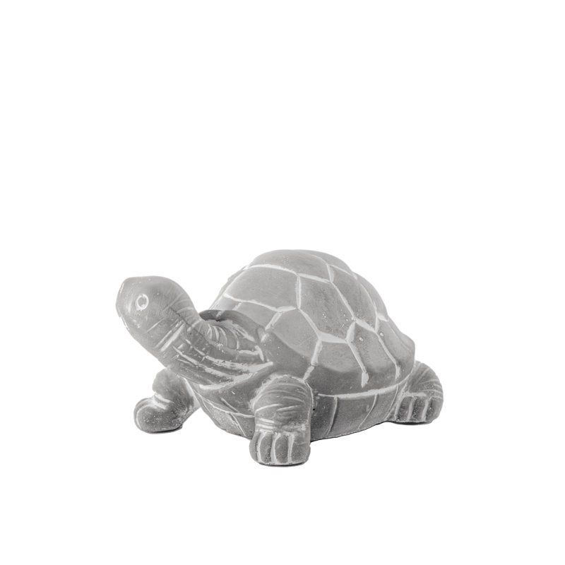 Figurine tortue faisant face à la droite