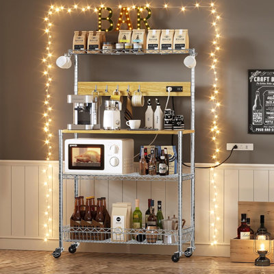 4-Tier Kitchen Baker’S Rack With Power Outlet And Storage, 33-Inch Microwave Stand Shelf With Wheels, Hooks, And Coffee Bar Cart Design – Metal Chrome Finish