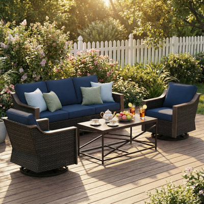 4-Piece Patio PE Wicker Conversation Set with Metal Coffee Table, Sofa, Swivel Chairs & Blue Cushions