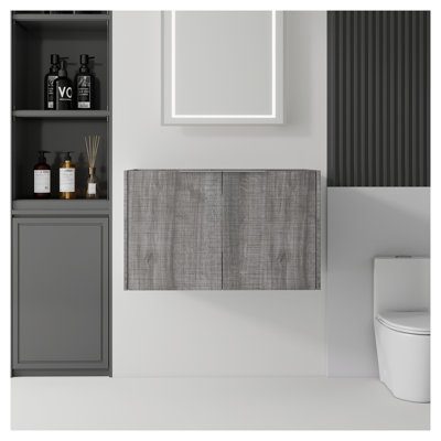 Meuble-lavabo suspendu de 76 cm (30 po) en gris, structure en contreplaqué, portes à fermeture amortie et rangement intérieur. Lavabo non inclus.
