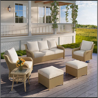 JB JAUNE Un canapé trois places + deux fauteuils pivotants + deux repose-pieds + une table