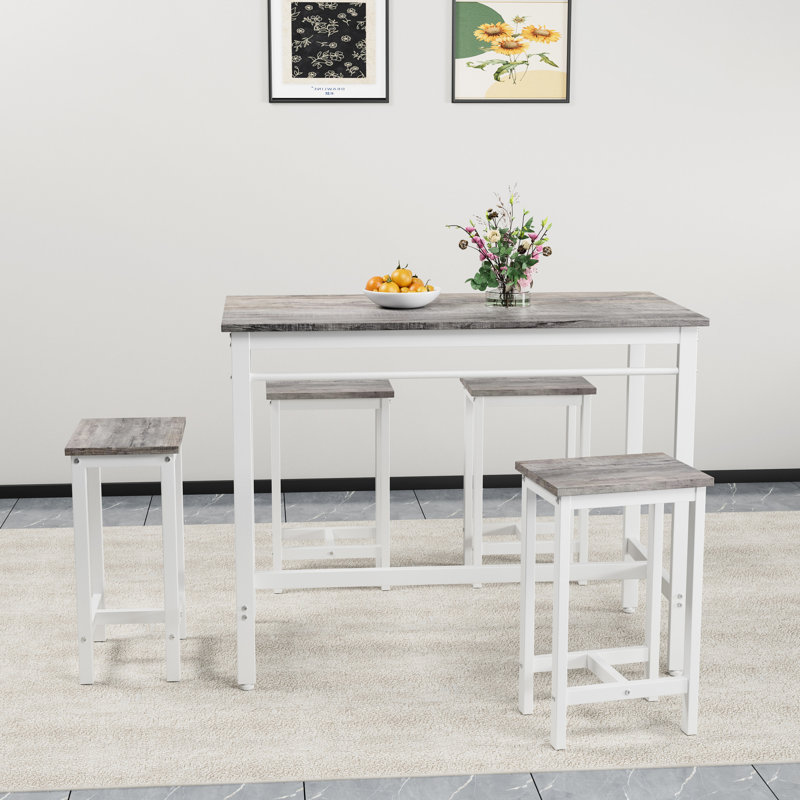 Table de salle à manger de style industriel 5 pièces avec quatre tabourets de bar, blanc chêne, métal pour la stabilité et blanc, pièce élégante