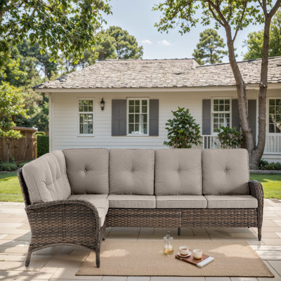 Serita Trym 100" Wide Outdoor PE Wicker Patio Sectional With Cushions by Lark Manor