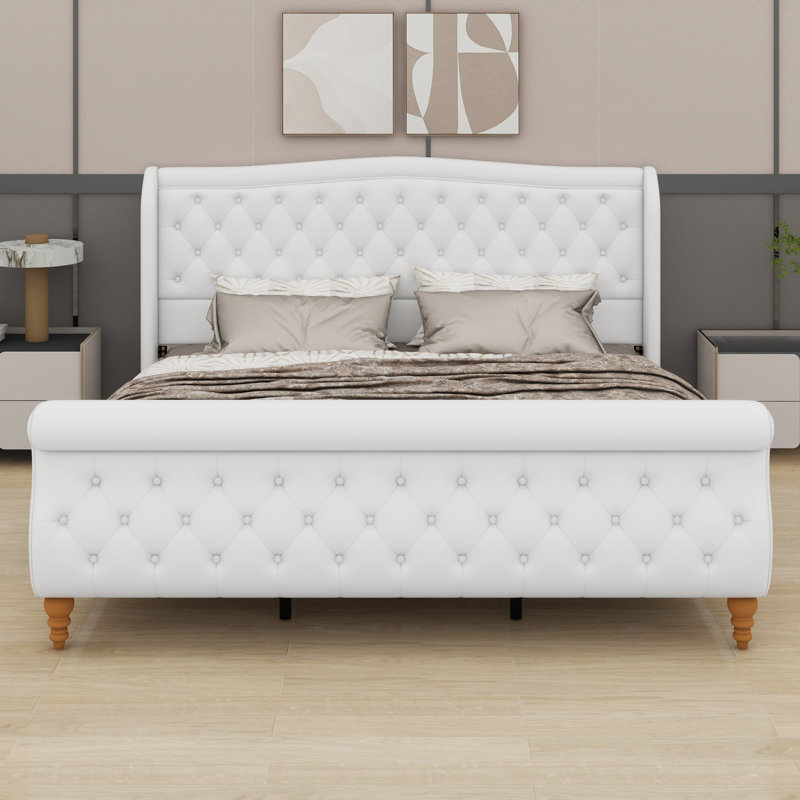Cadre de lit avec tête de lit à oreilles enveloppée et pied de lit traîneau pour une élégance intemporelle dans la chambre à coucher