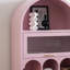 Bibliothèque arquée rose avec rangement