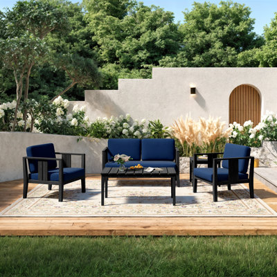 Ensemble de patio extérieur pour quatre personnes avec coussins et deux tables Polett