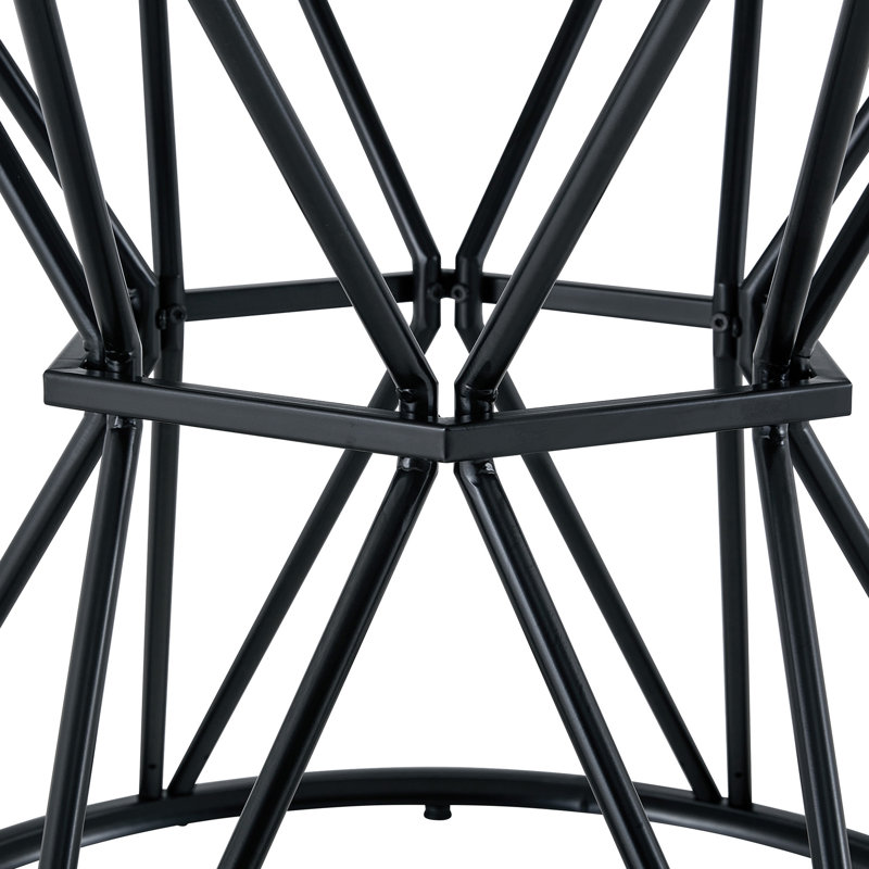 Une table de salle à manger circulaire d'un diamètre de 47,3 pouces, comprenant 4 plateaux de table en bois aggloméré noyer, des supports en métal en forme de sablier noir et une table de salle à manger de style industriel moderne pour 4 à 6 personnes.