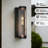 ALVIME 14.75" Modern Industrial Cylindrical Black and Antique Copper Outdoor Wall Sconce with Clear Glass