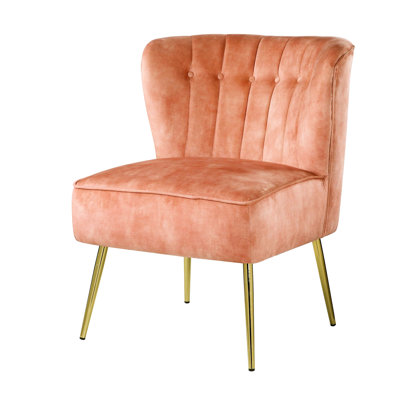 Fauteuil à oreilles en velours orange brûlé avec capitonnage texturé et pieds en métal stables