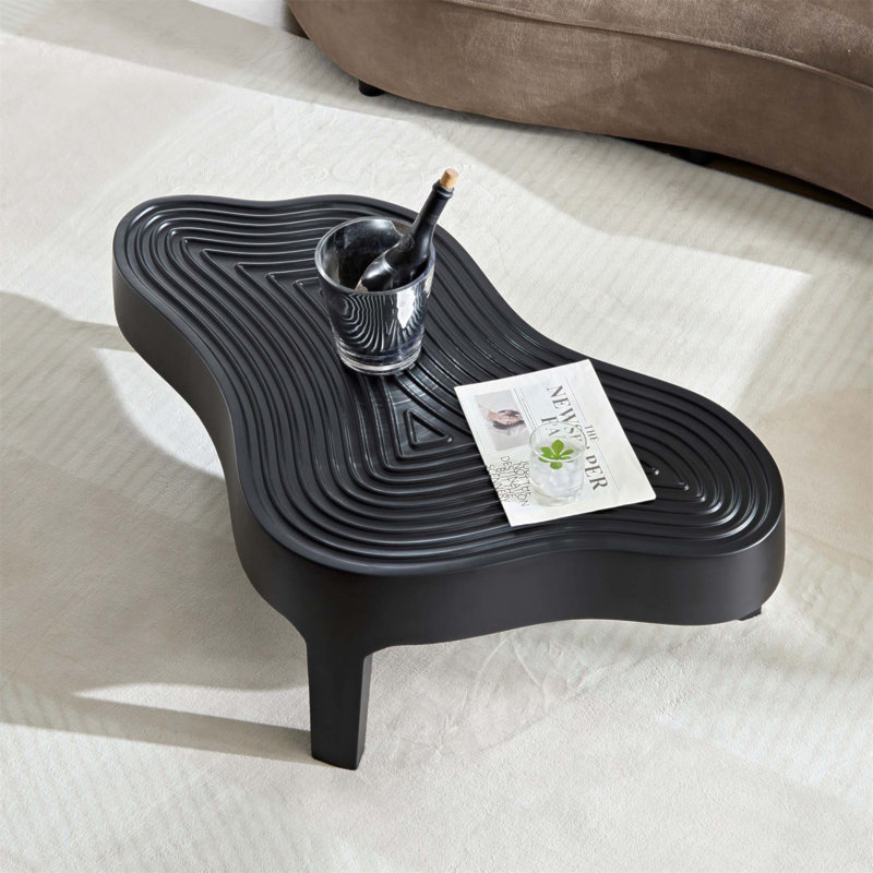 Élégante table basse en fibre de verre avec relief mat, aucun assemblage requis, parfaite pour les salons et les appartements modernes.