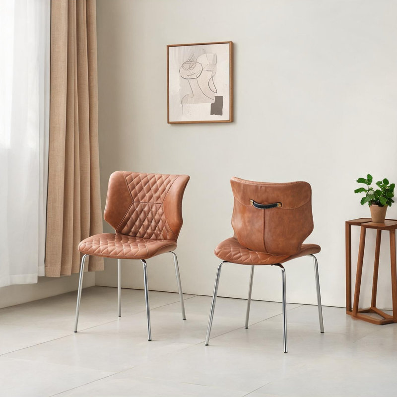 Ensemble de 2 chaises d'appoint brunes en cuir véritable avec dossier haut capitonné et pieds en métal pour la salle à manger