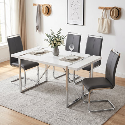Table de salle à manger rectangulaire moderne en bois manufacturé et chaises ergonomiques en similicuir avec pieds en forme de C