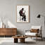 Tableau sur toile représentant un saxophoniste assis sur un tabouret en gilet rouge-554106032