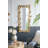 Elegant Full-Length Floor Mirror with Golden Leaf Accents, Perfect for Brightening and Expanding Living Spaces