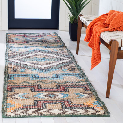Glynda Southwestern Handmade Flatweave Jute Tan Area Rug
