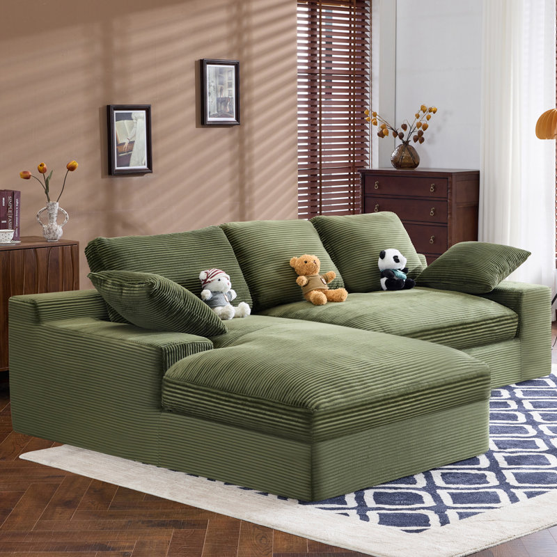 Canapé en velours côtelé vert. Il a une sensation d'assise douce et agréable pour la peau, ajoutant une atmosphère de guérison au salon chaleureux. Il est livré avec 3 coussins de dossier et 2 coussins décoratifs.