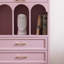 Bibliothèque arquée rose avec rangement