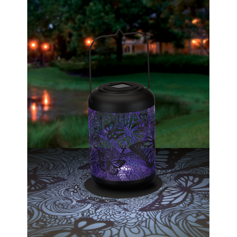 14.5 Inch Metal Solar Powered Outdoor Shadow Lantern with Decorative Cutout Patterns and Hanging Handle, Purple