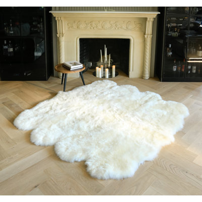 Novelty Colello Solid Color Handmade Sheepskin 7' x 6' Area Rug in Natural