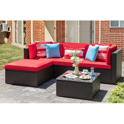 Ensemble de conversation modulaire en rotin 5 pièces avec canapé, coussins, coussins et table en verre