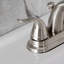 Robinet de salle de bain central à 4 poignées à 4 trous à fixation sur le comptoir avec robinet escamotable en plastique Kingston Brass Yosemite-13612061