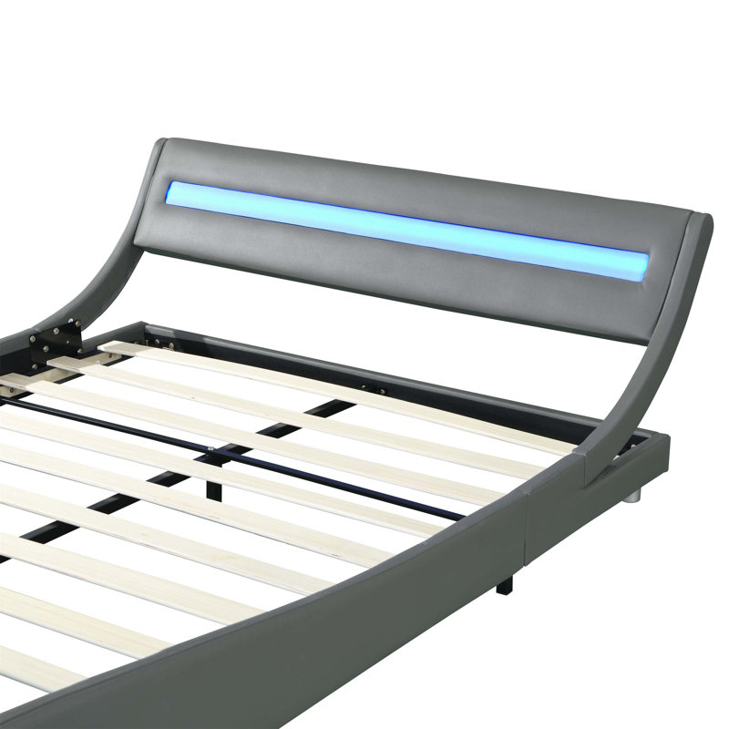 Structure de lit tapissier en similicuir avec éclairage à DEL RVB multifonctionnel et design incurvé pour une chambre à coucher confortable et moderne