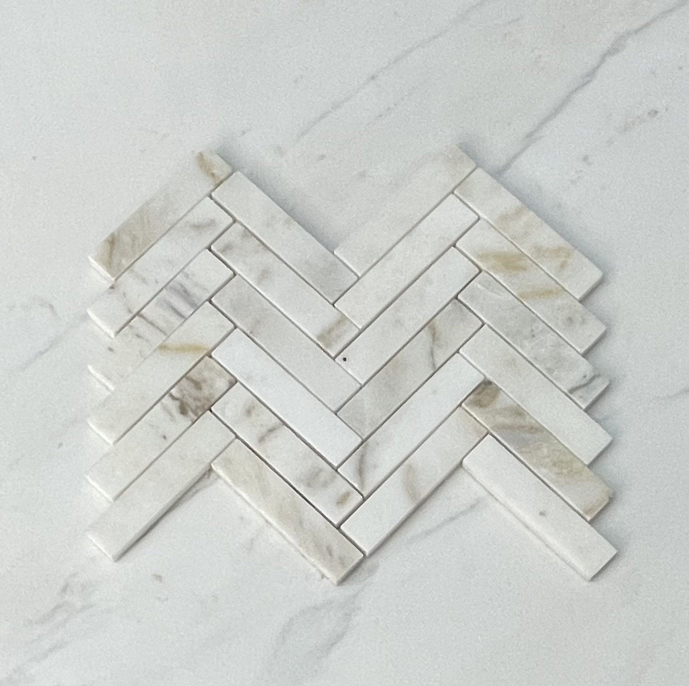 https://assets.wfcdn.com/im/22955677/compr-r85/2365/236540922/afyon-sugar-1-x-4-marble-natural-stone-herringbone-mosaic-sheet-wall-floor-tile.jpg