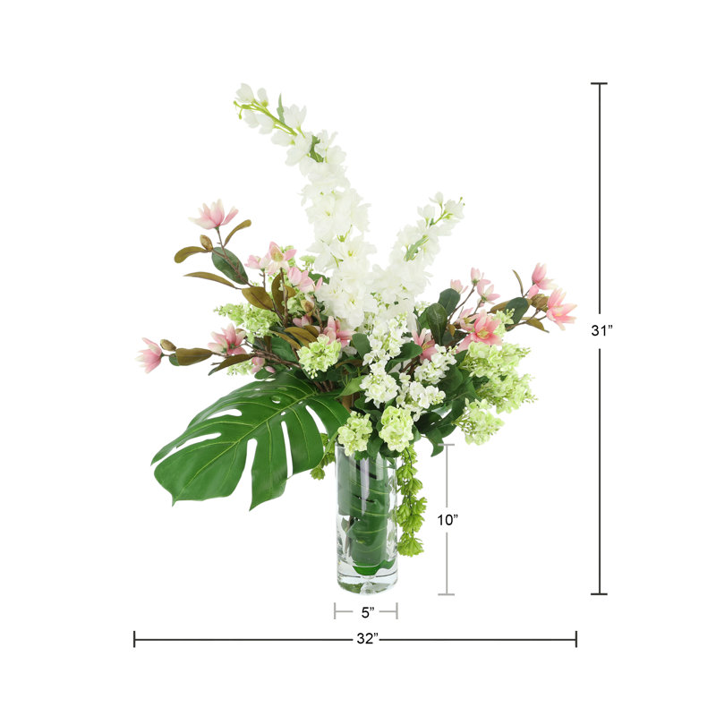 Arrangement delphinium, magnolia et lilas