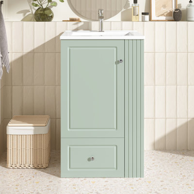 Meuble-lavabo autoportant moderne de 20 po avec lavabo en céramique, rangement et porte lisse pour l'organisation de la salle de bain. Finition de 20 po, trou de robinet simple, tiroir à fermeture en douceur