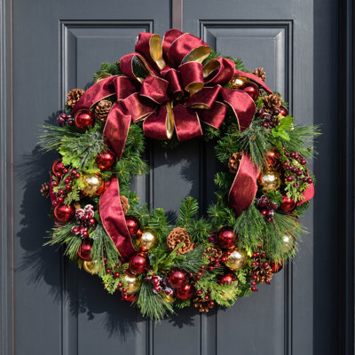 Pulaski Burgundy and Gold Ornaments, Burgundy Berries, Gold Pinecones on an Evergreen Wreath with a Bow