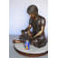Statue en bronze Romy Sandra assise avec son lapin - Taille: L 25 po x l 18 po x H 25 po.