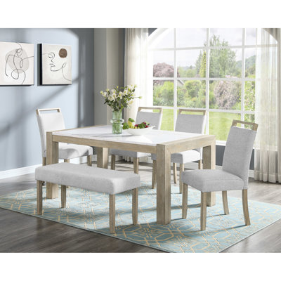 Ensemble de salle à manger 6 pièces au style moderne, comprenant une table rectangulaire en marbre et des chaises rembourrées, idéal pour une utilisation dans la chambre.