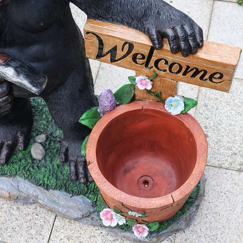 Statue gorille noire en résine avec panneau de bienvenue et pot de fleurs