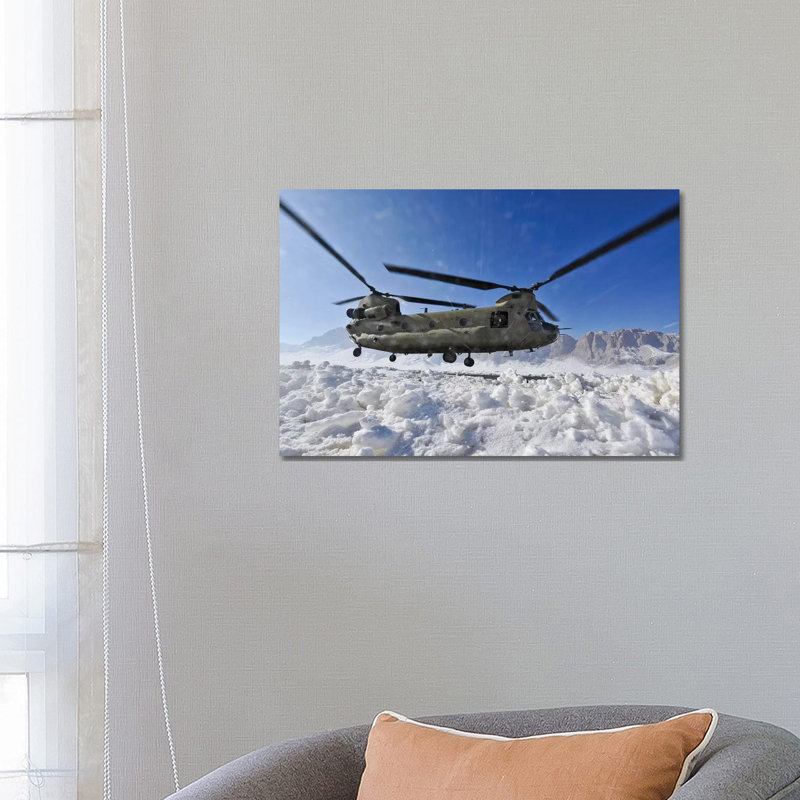 Snow Flies Up As A US Army CH-47 Chinook Helicopter Prepares To Land by Stocktrek Images - Wrapped Canvas Print