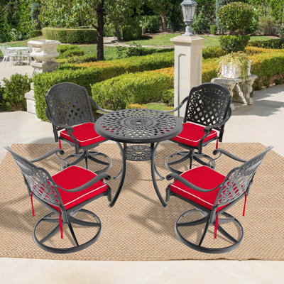 L'ensemble de salle à manger en fonte d'aluminium toutes saisons comprend 2 chaises pivotantes et une table ronde avec cadre