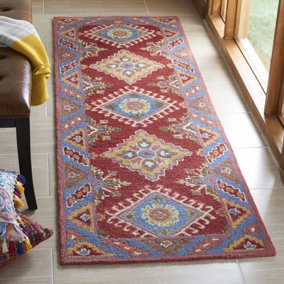 Vahakn Hand Tufted Wool/Cotton Southwestern Rug in Blue/Red