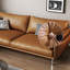 Causeuse coussin orange en cuir véritable-489090960