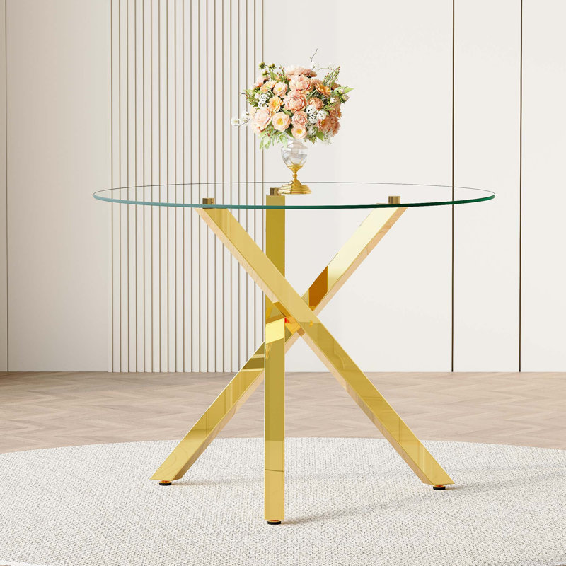 Table de salle à manger ronde moderne en verre avec structure en métal en forme de X