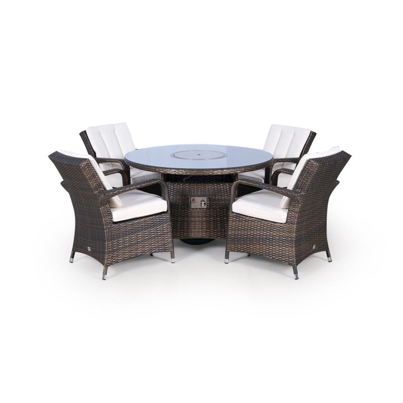 Pacheco 4 - Person Wicker Patio Dining Set with Round Table , Cushions Included, Brown, Beige